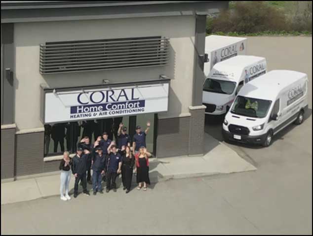 pic of the Kelowna's Coral Home Comfort team, standing outside of their Kelowna office Building, waving to you!